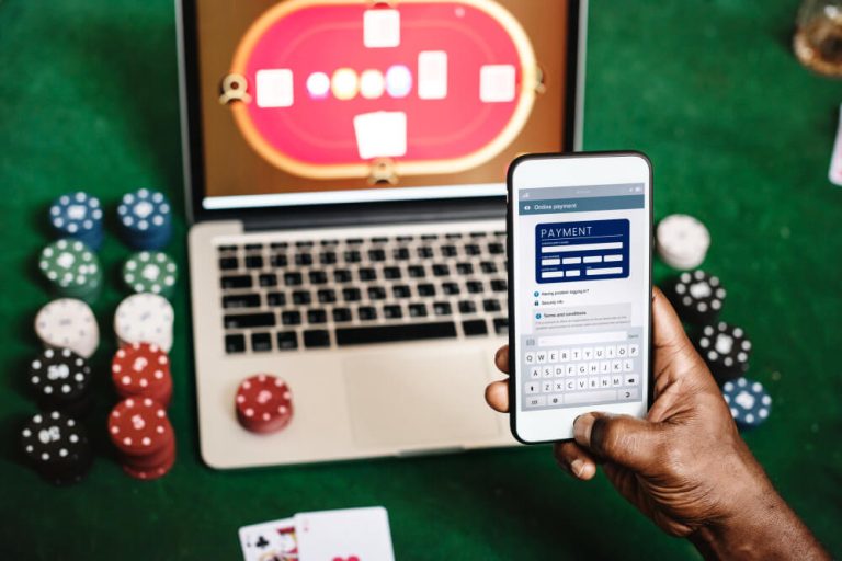 hand-holding-card-playing-online-gambling